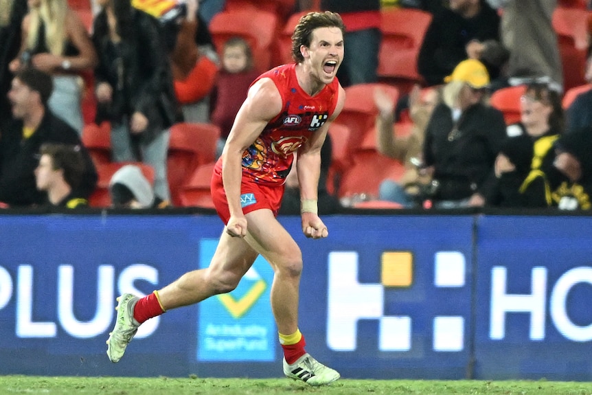 Noah Anderson celebrates kicking the winning goal for Suns