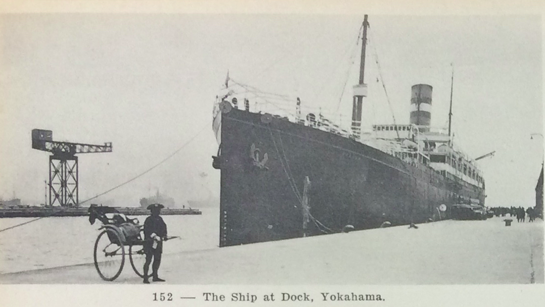 Black and white photograph of a boat docked in Yokohoma. 