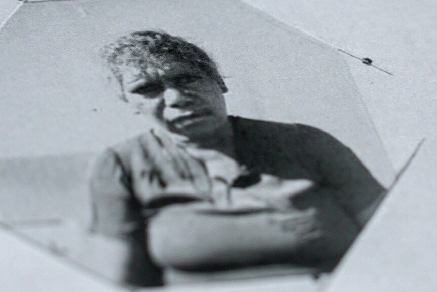 a historic black and white photo of an Aboriginal woman