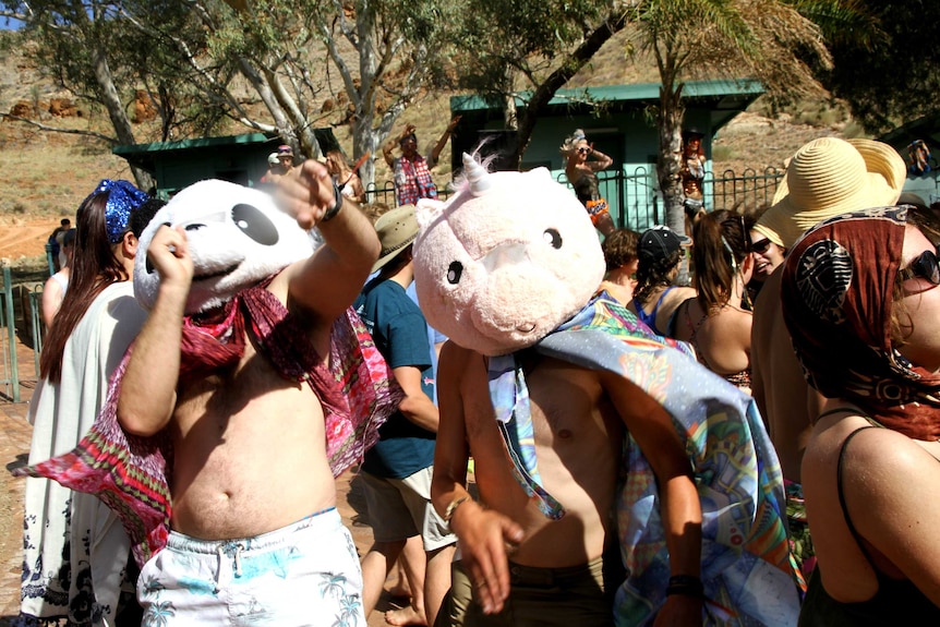 Festival goers dressed up as a panda and a unicorn in a crowd. May 2018. Wide Open Space Festival