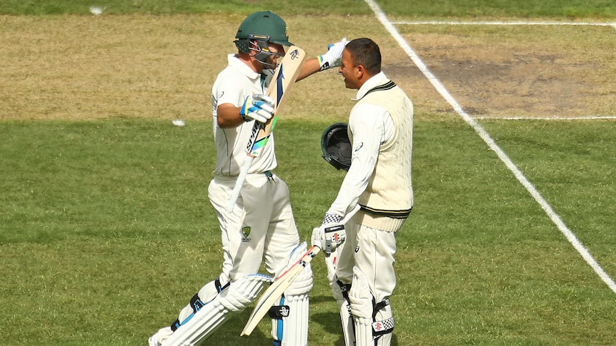 Khawaja and Burns embrace after both reaching 100
