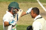 Khawaja and Burns embrace after both reaching 100