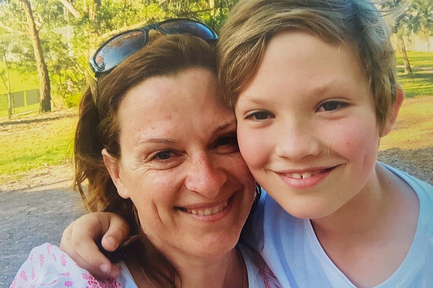 Jack Power with his mother Bonnie smile at the camera.