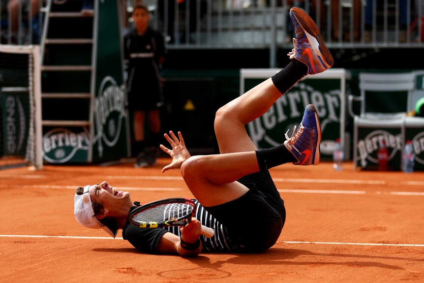 Thanasi Kokkinakis celebrates his second-round win over Bernard Tomic at the French open