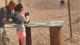 A nine-year-old girl fires an Uzi