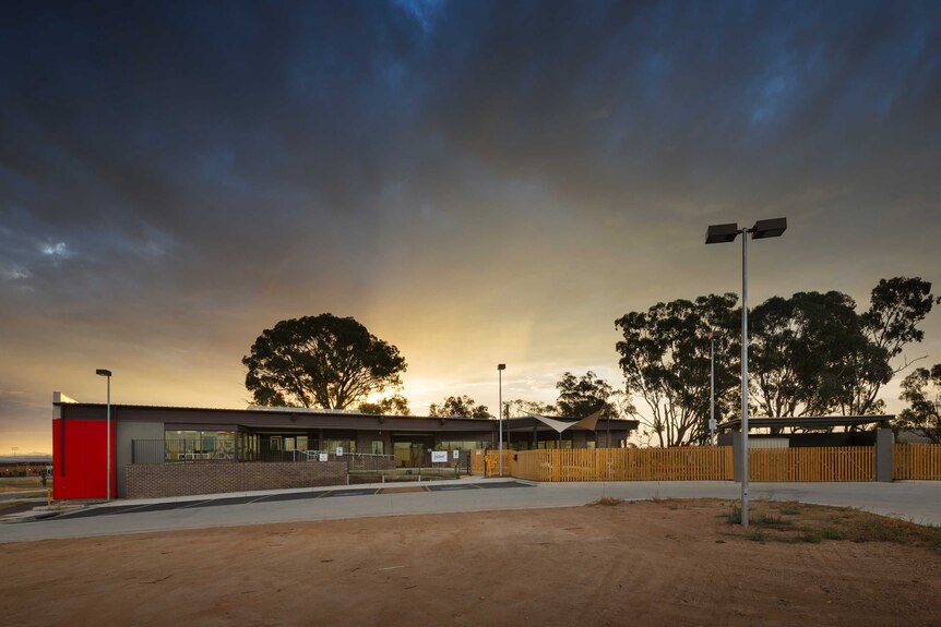 The Sun setting over a childcare centre.