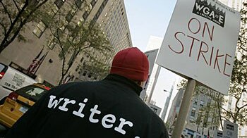 A writer joins other members of the Writers Guild of America on November 5, 2007, to picket the Rockefeller Centre, the headq...