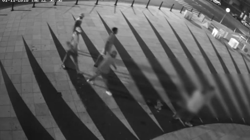 Black and white CCTV footage of youths in St Kilda.