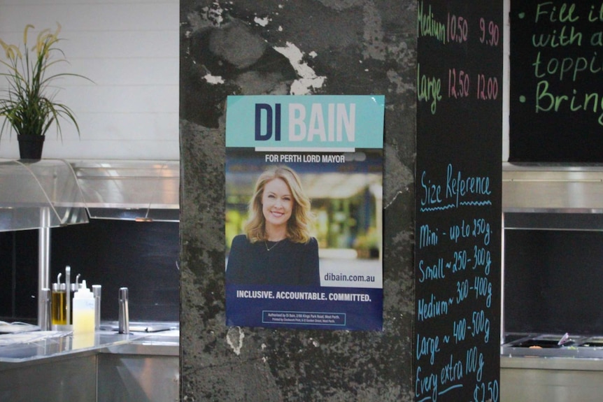 A poster supporting Di Bain for Perth's Lord Mayor hanging on a post at an East Perth cafe.