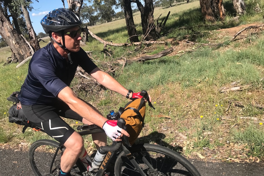 David Mark on his bike on a country road.