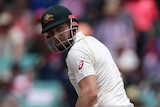 Shaun Marsh looks behind him as the slip fielder stoops to take the catch