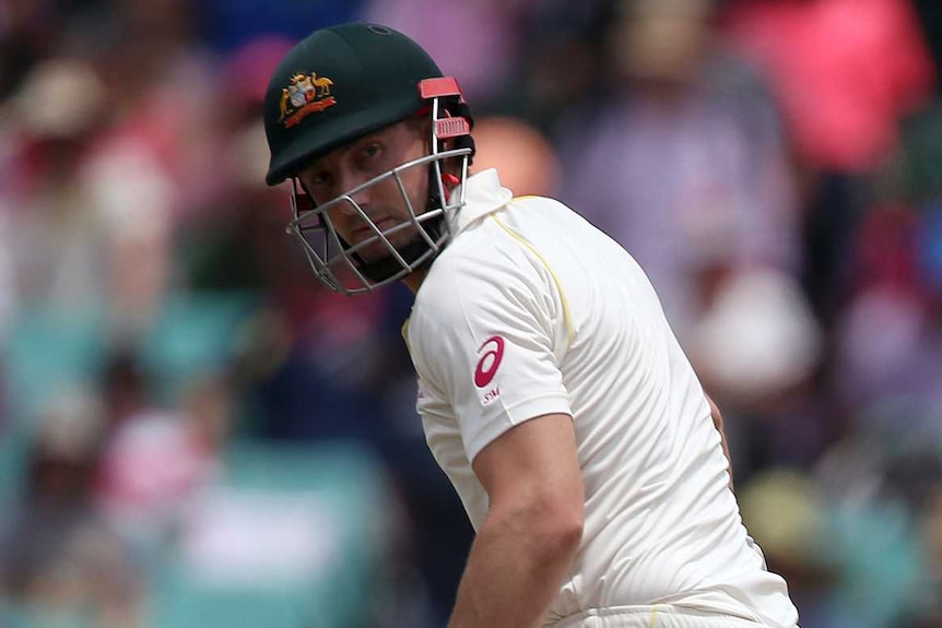 Shaun Marsh looks behind him as the slip fielder stoops to take the catch