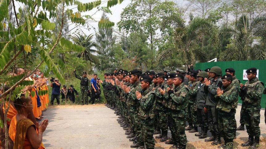 Thai police and soldiers stand off against monks