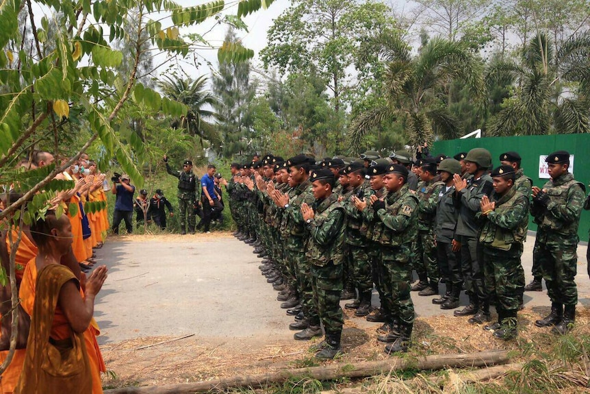 Thai police and soldiers stand off against monks