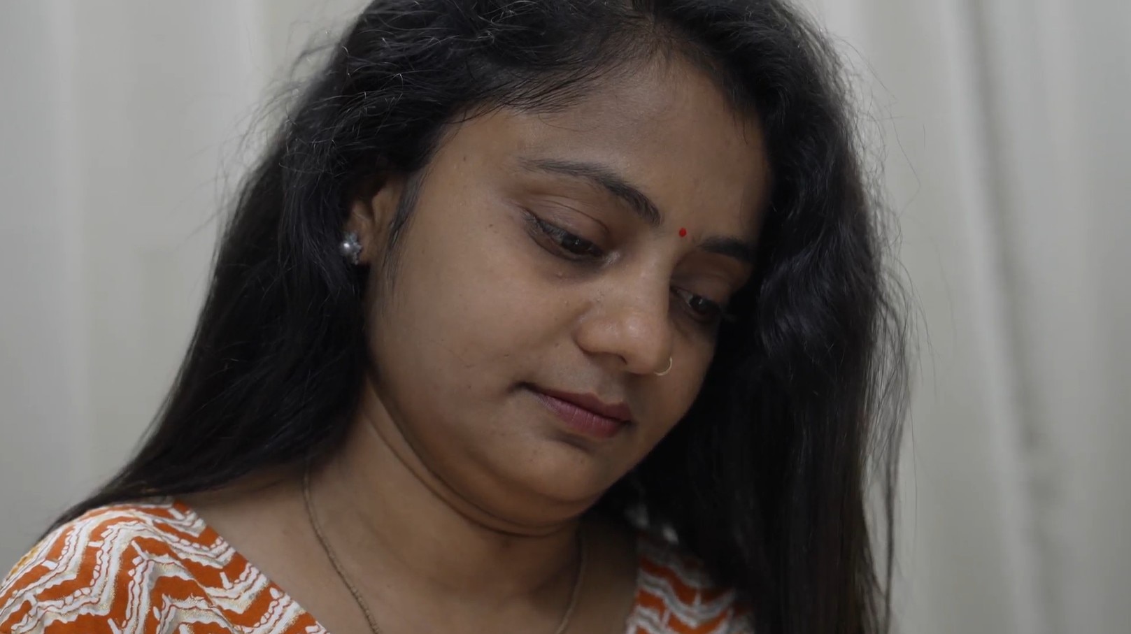 Closeup of an Indian woman with her hair open.