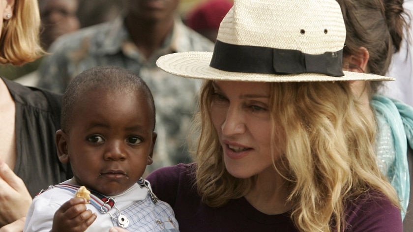 Madonna holds her adopted son David Banda.