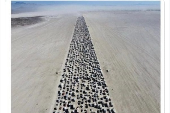 Long lines of cars are seen in the desert in a twitter post.