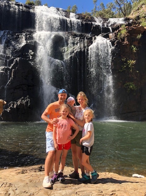 The Schoon family standing in front of the MacKenzie Falls in the Grampians.