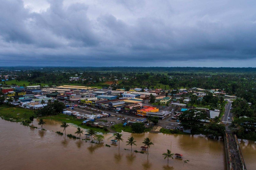 Aerial shot of a river that has burst its banks in Fiji.