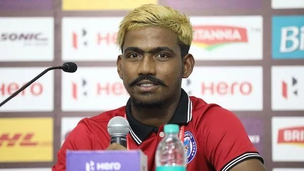 Gourav Mukhi sits at a post match press conference following an Indian Super League match.