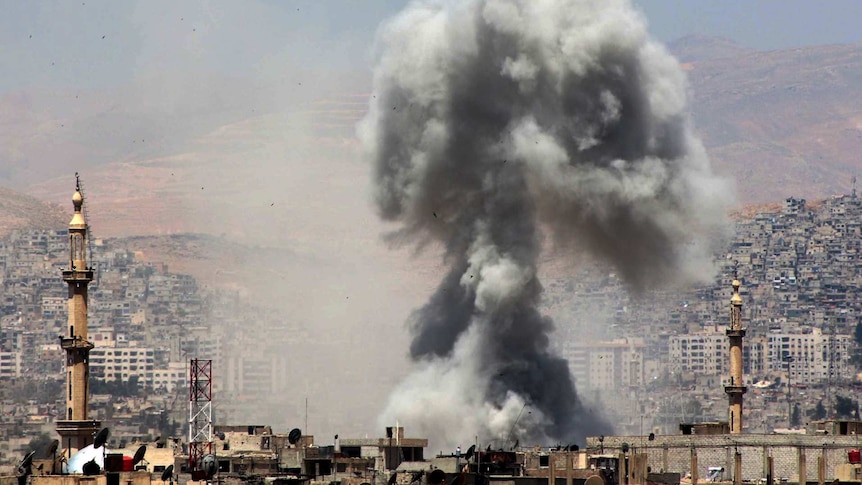 Smoke rises over the area of Eastern Ghouta