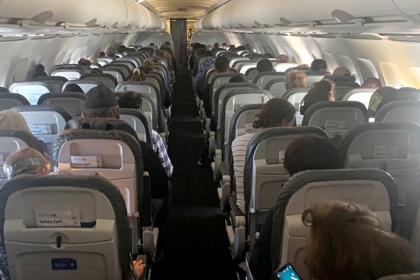 Inside the packed plane on a flight from San Francisco to Washington DC.