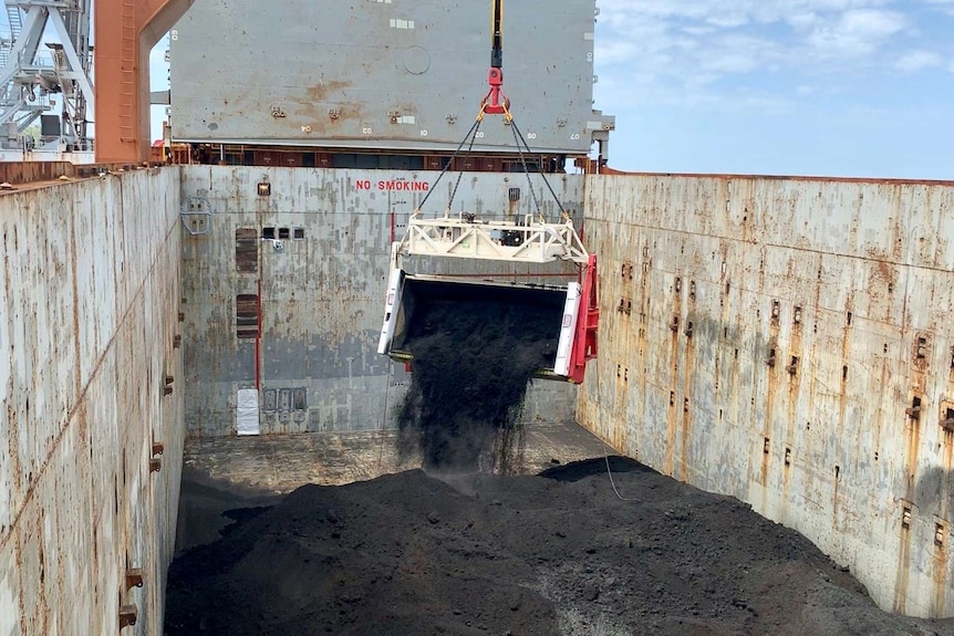 Nickel concentrate being tipped inside bulk carrier ship