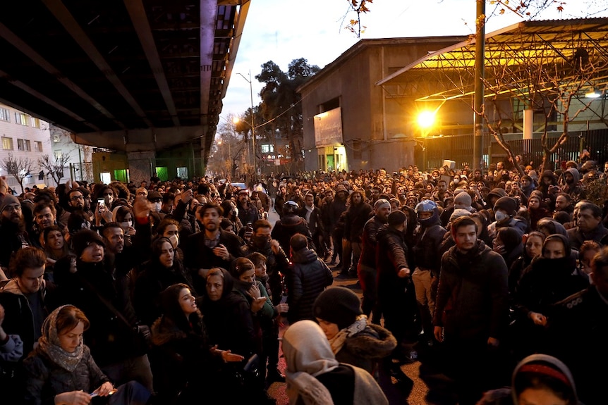 People gather at candle light vigil