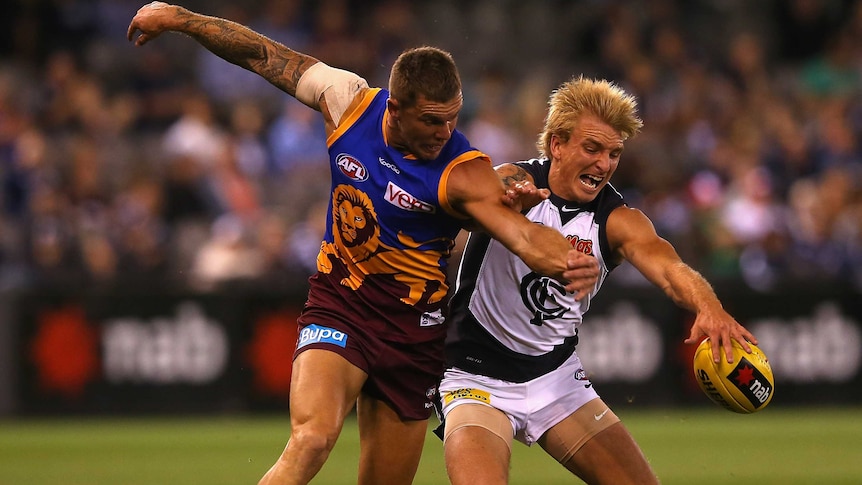 Lions' recruit Brent Moloney (L)