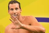 Gallant effort ... Grant Hackett waves to the crowd after his 200 metres freestyle semi-final in Adelaide