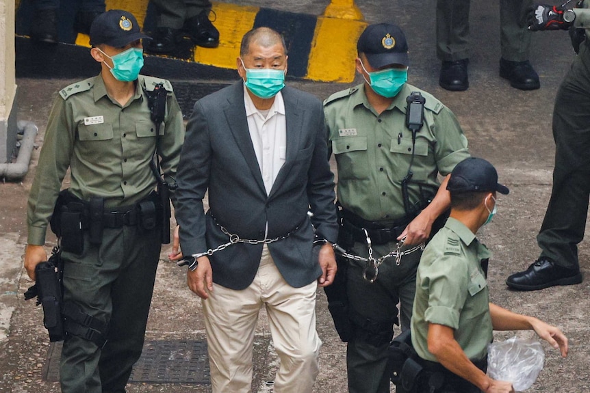 Hong Kong tycoon Jimmy Lai in shackles.