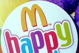 McDonalds Happy Meal logo on the side of a Happy Meal box