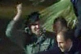 A TV still of a man believed to be Khamis Gaddafi greeting supporters in Tripoli on March 29, 2011.