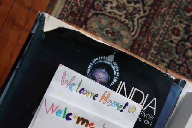 Handmade cards that say 'welcome home' and 'welcome back'