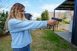 A woman with a gun.