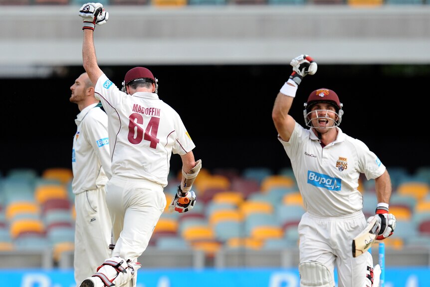 Chris Hartley (right) and Steve Magoffin celebrate the winning runs to cap their 45-run stand.