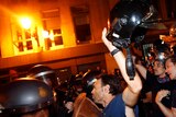 Firemen confront Spanish National Police during a protest against government austerity measures.