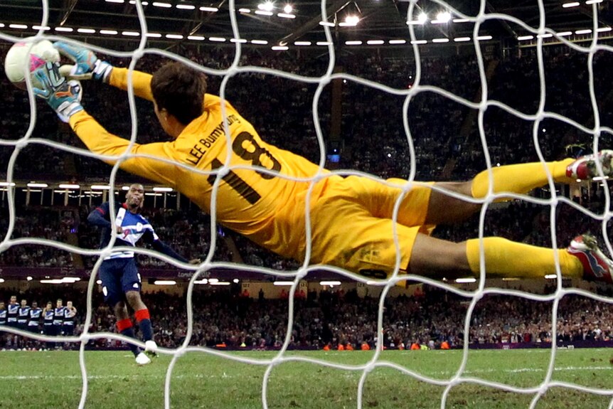 Britain's Daniel Sturridge has his penalty saved by South Korea's goalkeeper Bumyoung Lee.
