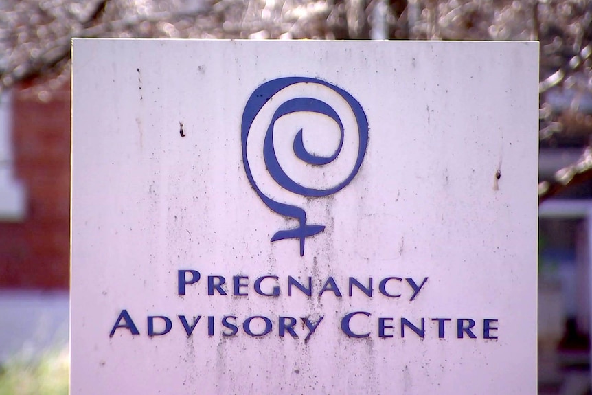 A sign bearing the words "pregnancy advisory centre".