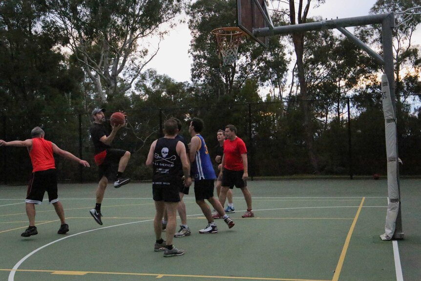Politicians play a game of basketball at Parliament House during a sitting week.