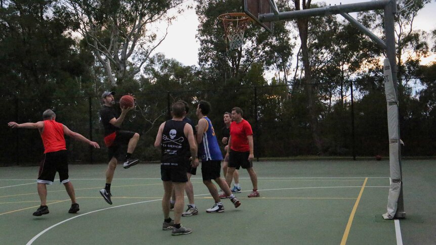 Politicians play a game of basketball at Parliament House during a sitting week.
