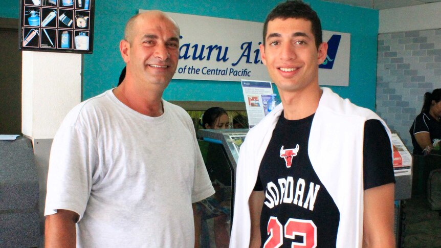 Ahmed and Ali Kharsa prepare to fly out of Nauru