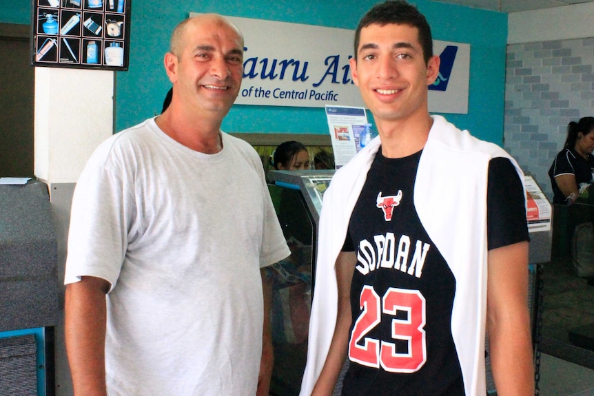 Ahmed and Ali Kharsa prepare to fly out of Nauru