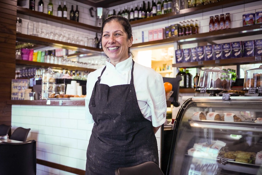 Maria Tuminello stands in her cafe, which will operate as a takeaway during renewed COVID-19 restrictions in Victoria.