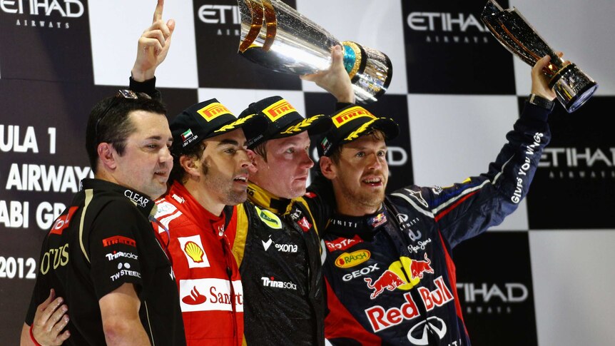 Back on the podium ... Kimi Raikkonen (2nd right) won his first grand prix in three years