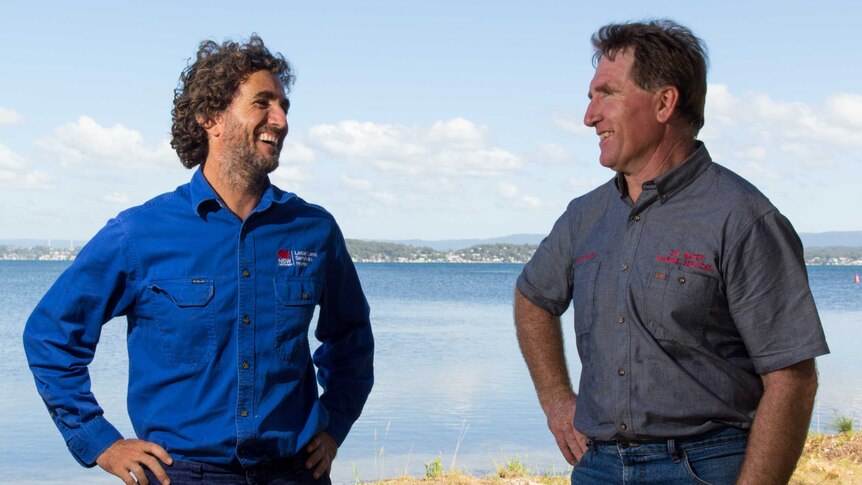 Brian Hughes and Des Maslen share a laugh next to Lake Macquarie.