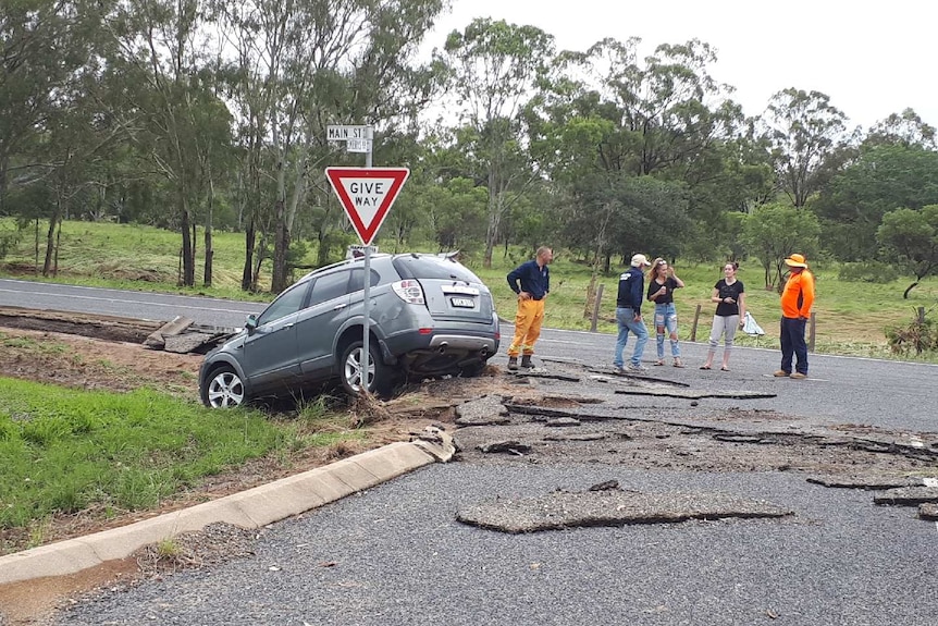 A car off the road and road damage