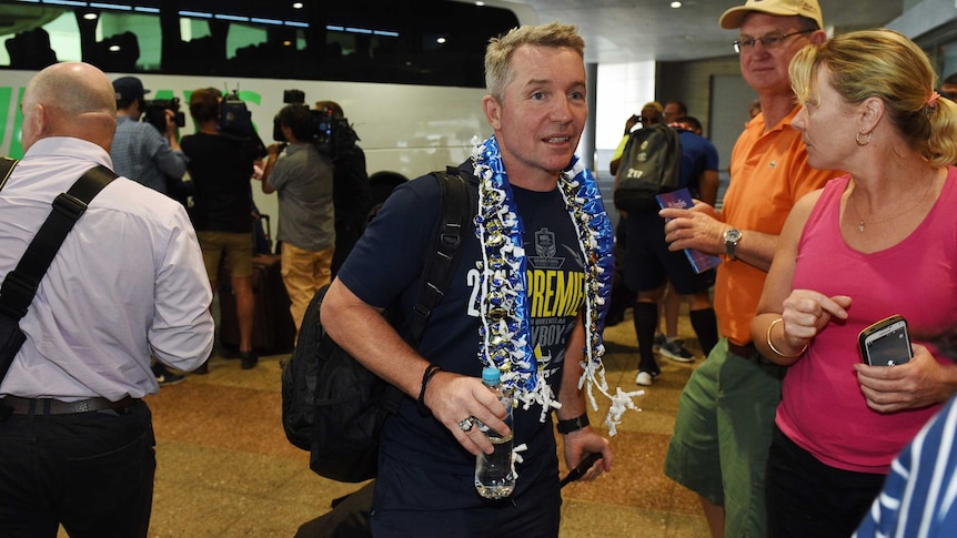 North Queensland Cowboys coach Paul Green arrives at Sydney Airport for the flight back to Townsville, after winning the NRL Grand Final yesterday.