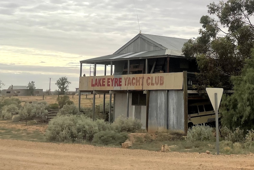 an old building with Lake Eyre Yacht Club on its signage.