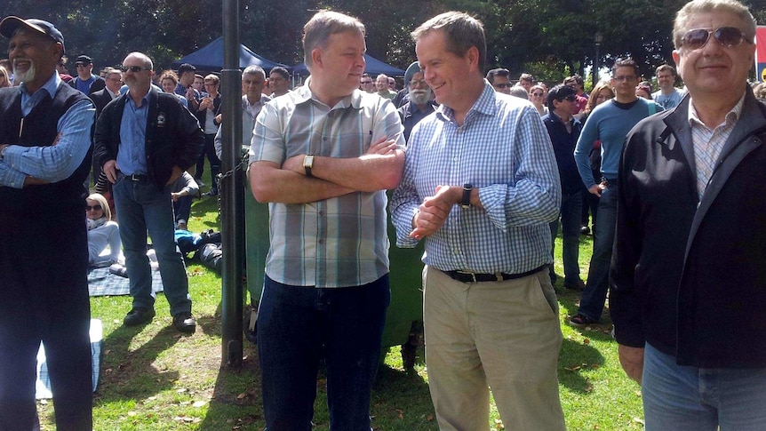 Anthony Albanese and Bill Shorten chat before speaking at Hyde Park in Perth.